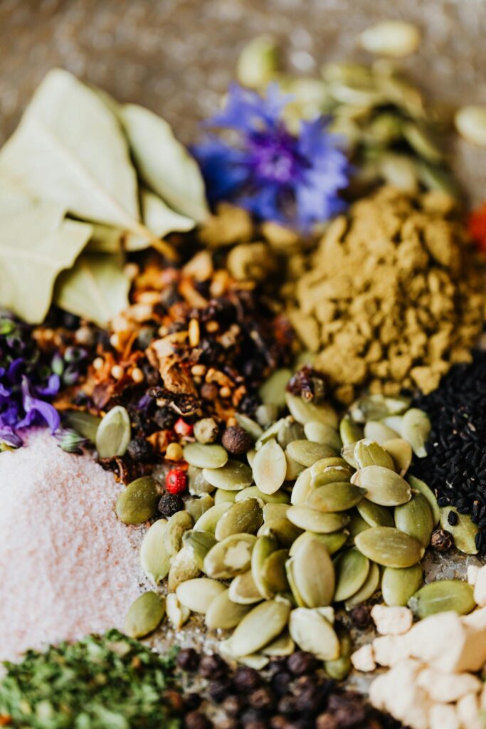 A colorful mix of herbs, spices, and seeds, richly showcasing natural ingredients.